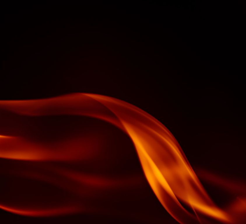 Orange flames rising over a black background