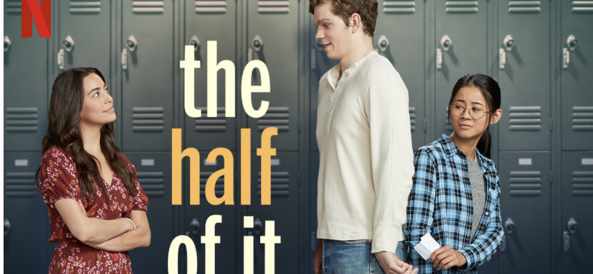 poster of the half of it with the red Netflix logo on the top left corner. a woman in a dress stands with folded arms looking at a tall man. hidden behind him is a woman in glasses handing him a note.