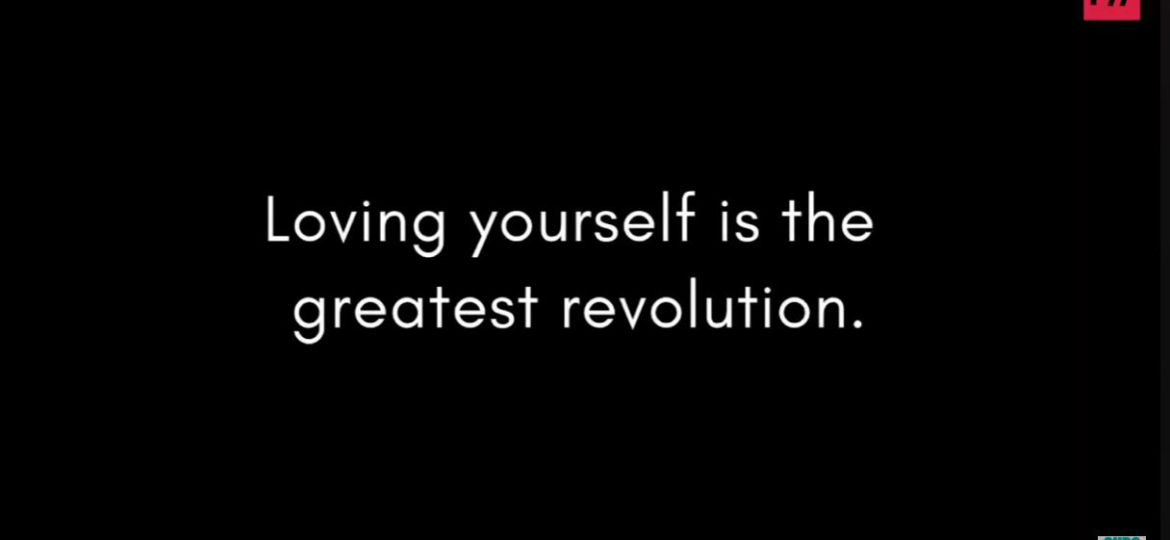 A screenshot from Trans People Talk. The text “Loving yourself is the greatest revolution” displayed over a black background.