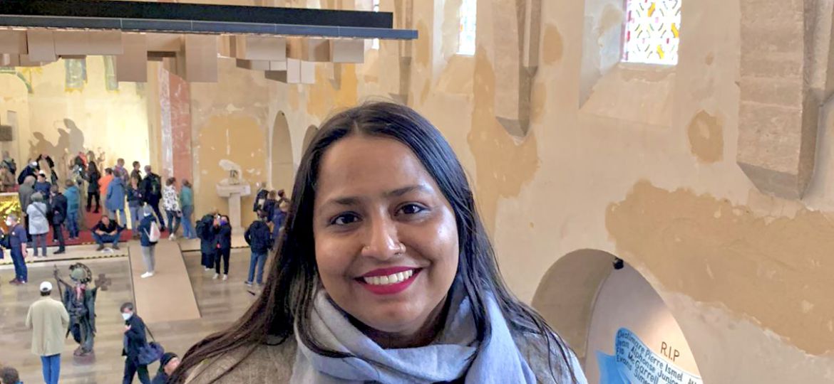 A photo of Jyotsna Sidhharth smiling and looking directly at the camera.