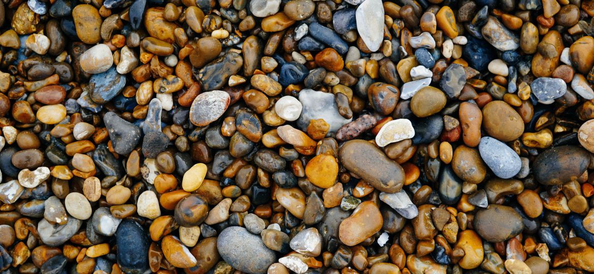 A shot of rocks and pebbles of different bodies, shapes, sizes, and colours.