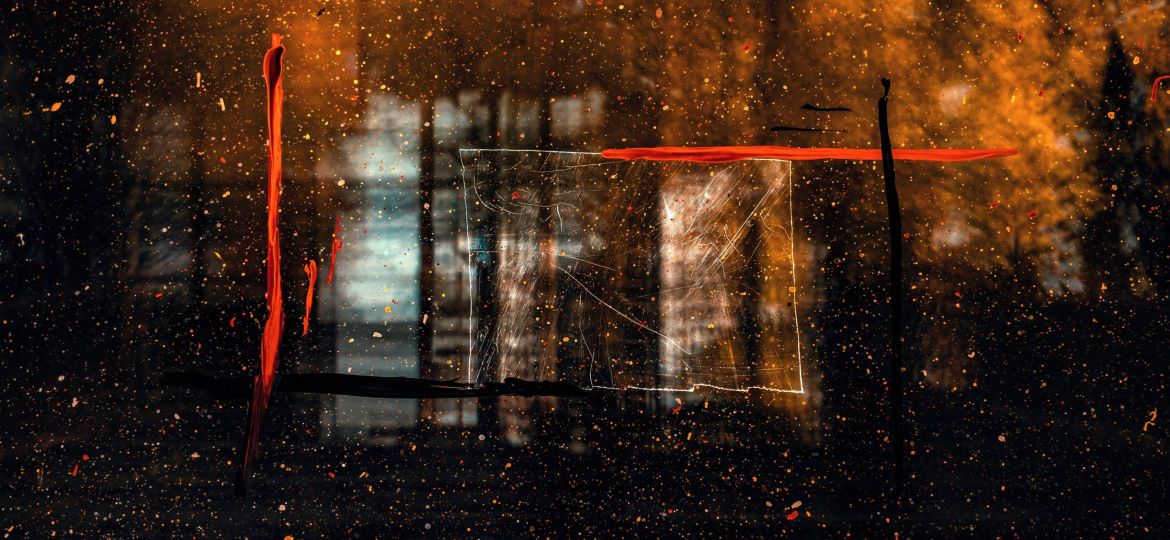 an abstract photograph of water droplets on a glass window. The photo has a burnt sienna and orange overlay with some scratches in white, orange and black on the window.