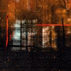 an abstract photograph of water droplets on a glass window. The photo has a burnt sienna and orange overlay with some scratches in white, orange and black on the window.