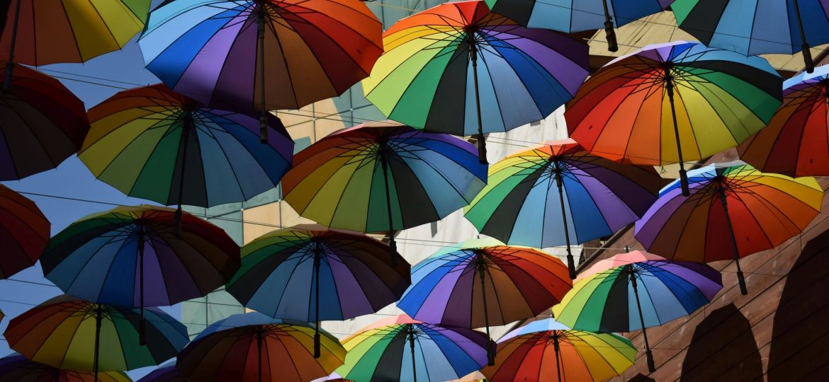 A sky full of open multi-coloured umbrellas