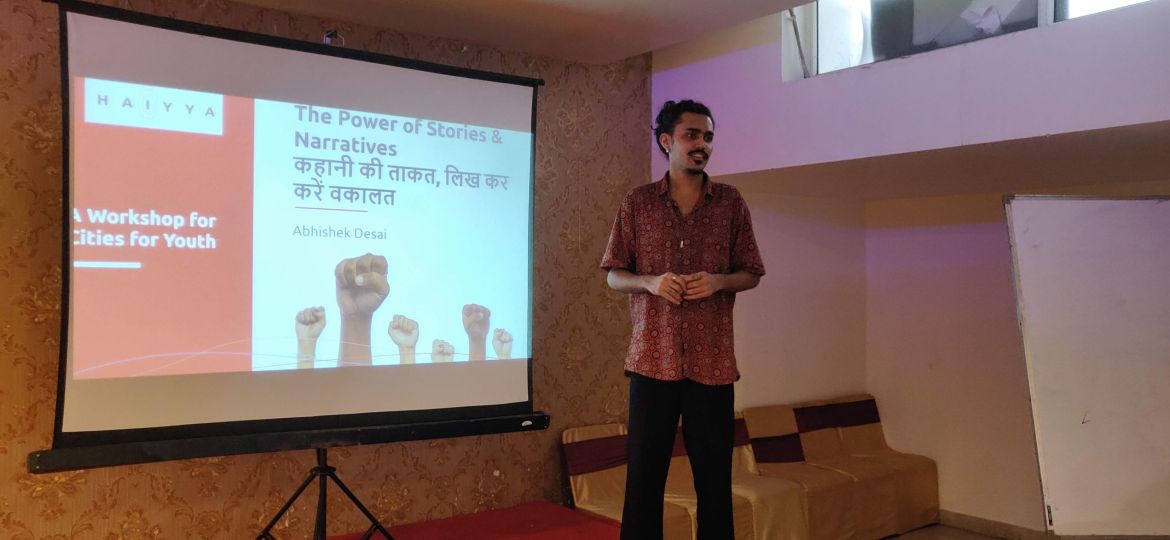 A photo of Abhishek delivering a presentation on "The Power of Stories and Narratives".