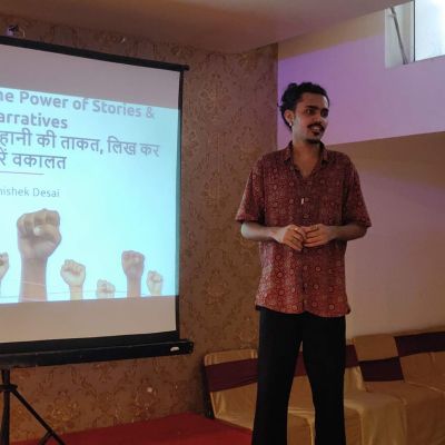 A photo of Abhishek delivering a presentation on "The Power of Stories and Narratives".
