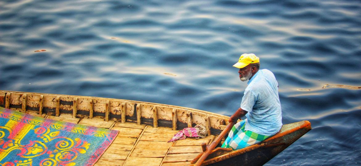 man riding boat during daytime