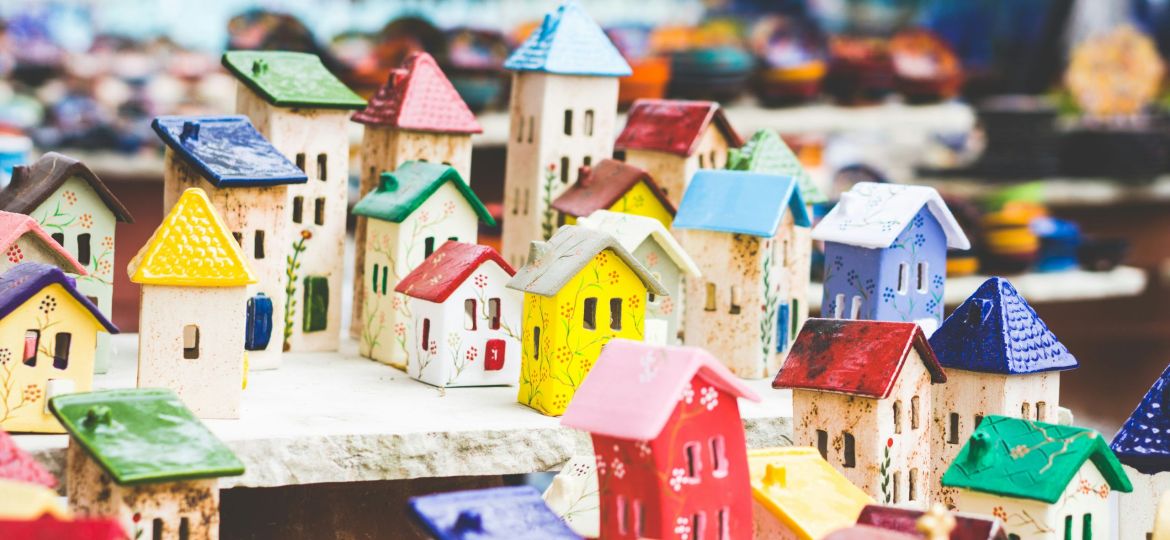 An arrangement of miniature colourful ceramic houses