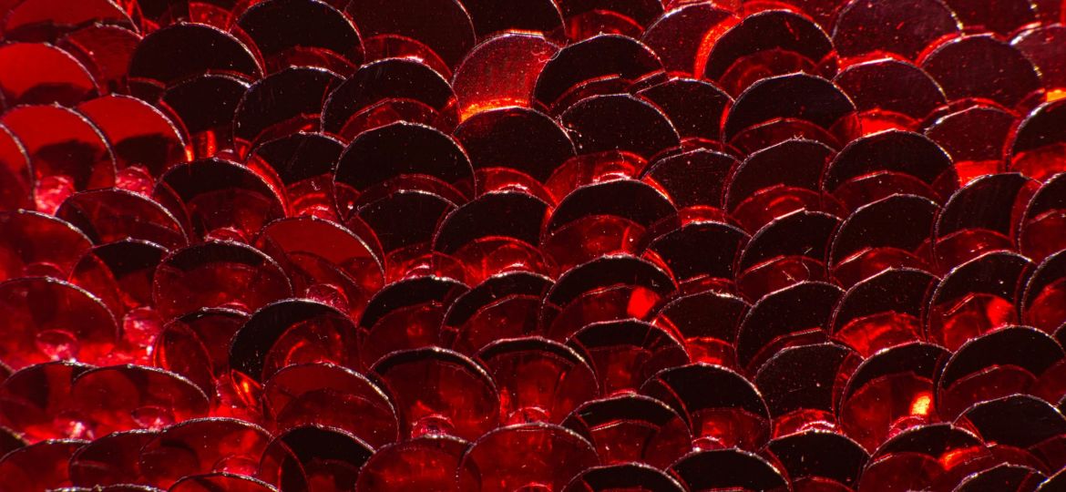 Close up of sequins on a sequin dress.
