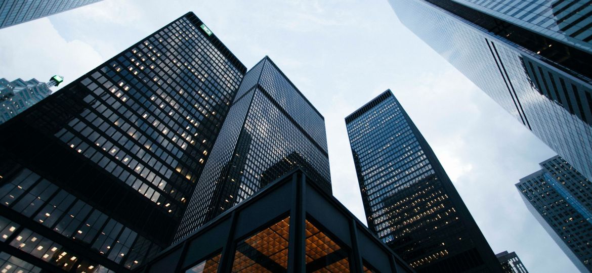 low angle photo of city high rise buildings during daytime