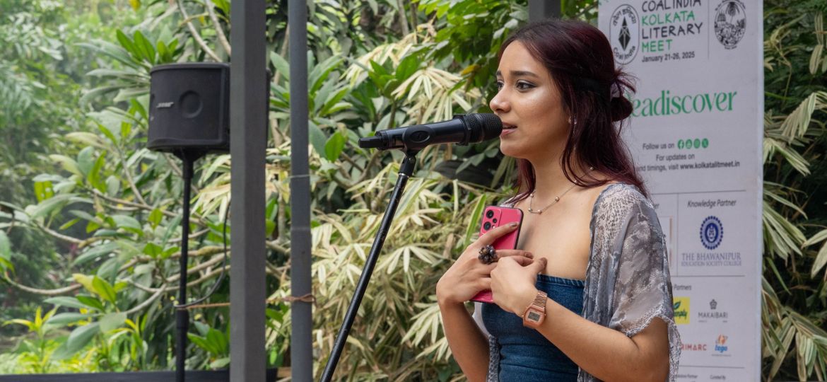 A photo of Sara Haque performing on stage