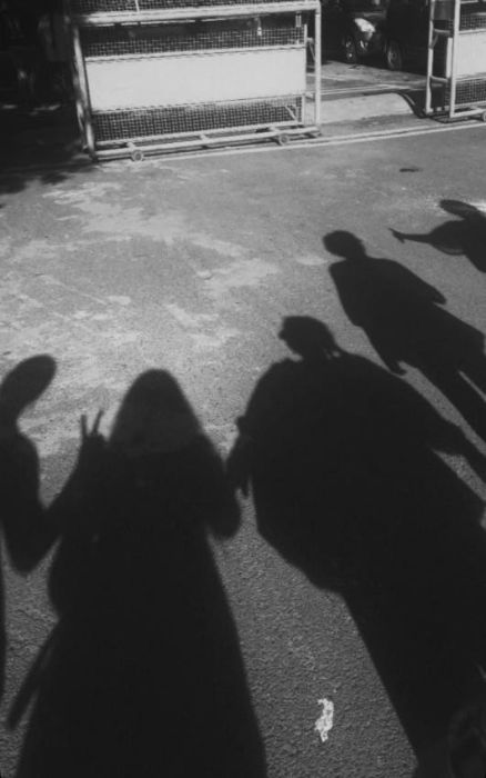 Shadow of friends on the street