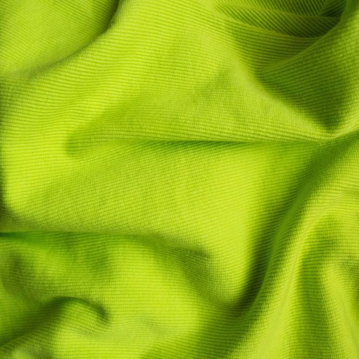 A lime green fabric with a black background