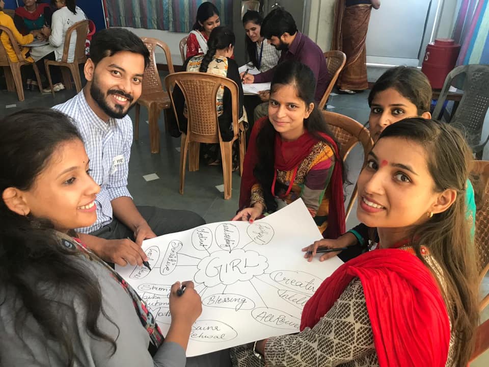 4 (1) Teachers from Udaya School sitting in a circle with a chart paper for an activity