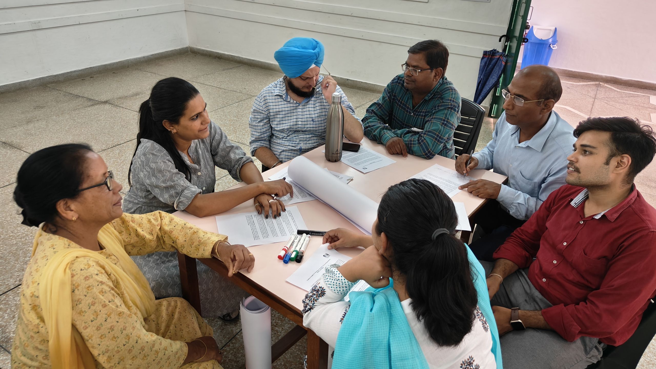 oplus_2 A group of teachers sitting in a circle and having a discussion