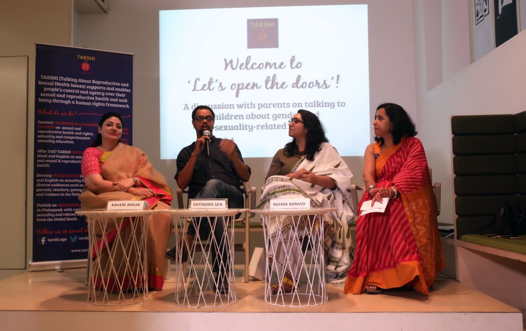 cse-bg-2 Image of a panel discussion "Let's Open The Doors" with four people on the stage. Behind them is the projected screen with the text "Welcome to Let's Open The Doors." and TARSHI's banner.